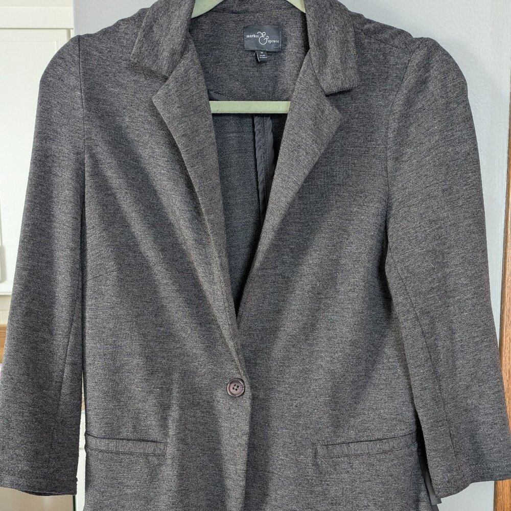 Soft gray blazer with flouncy back
